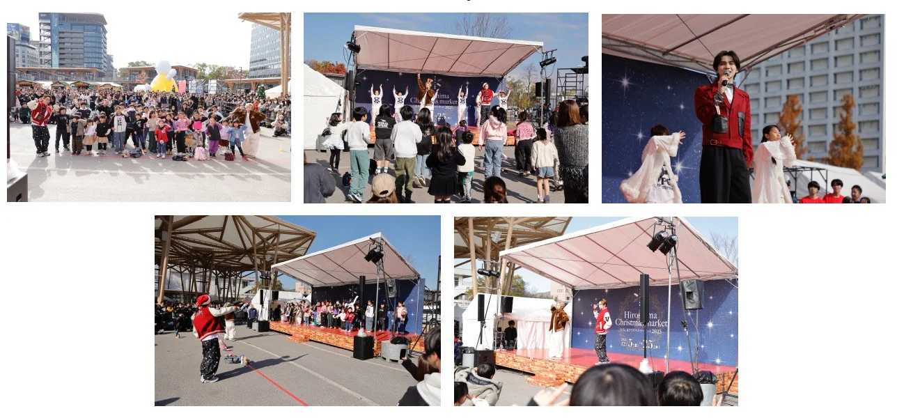 クリスマスマーケットのステージでパフォーマンスする出演者と観客