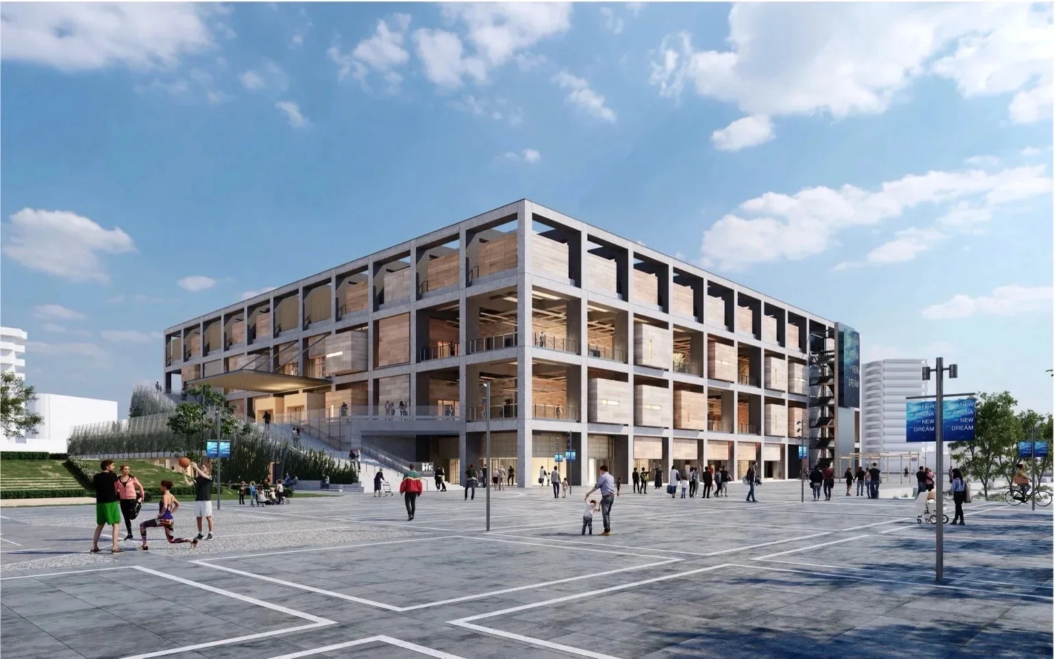 現代的なデザインの大型建築物とその前の広場